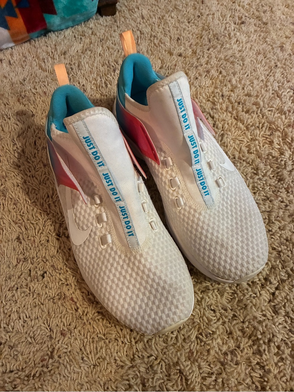 Nike women’s White Sneakers with Pink & Teal Accents running shoe